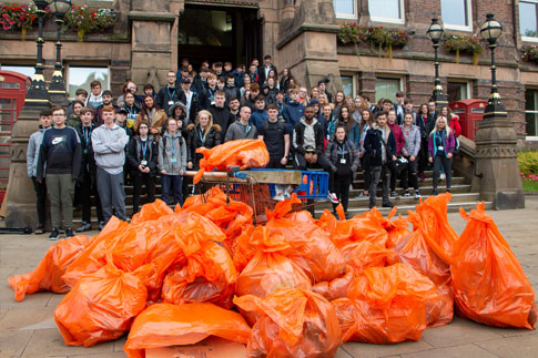 Picture of our students with their litter pickers and rubbish bags.
