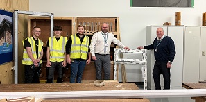 Picture of Carpentry and Joinery apprentices and tutors with items donated by GAP