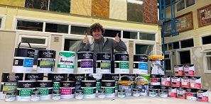 Picture of Painting and Decorating apprentice Alex with the paint donation