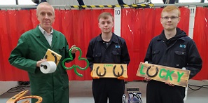 Picture of staff and students with horseshoe products