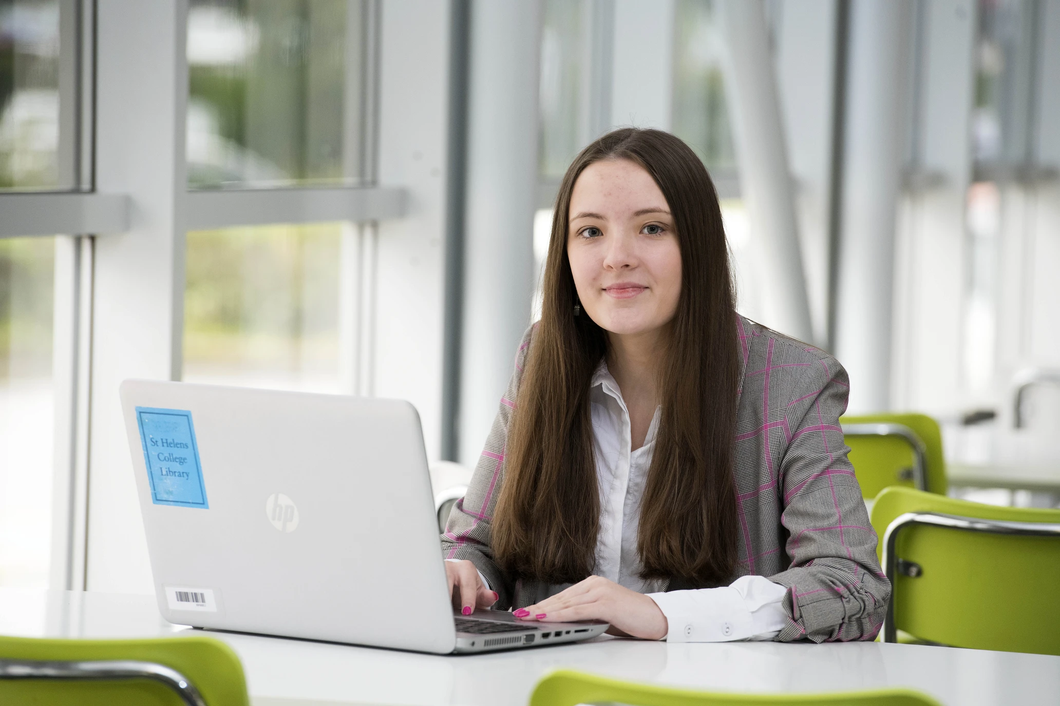 girl studying at desk with laptop