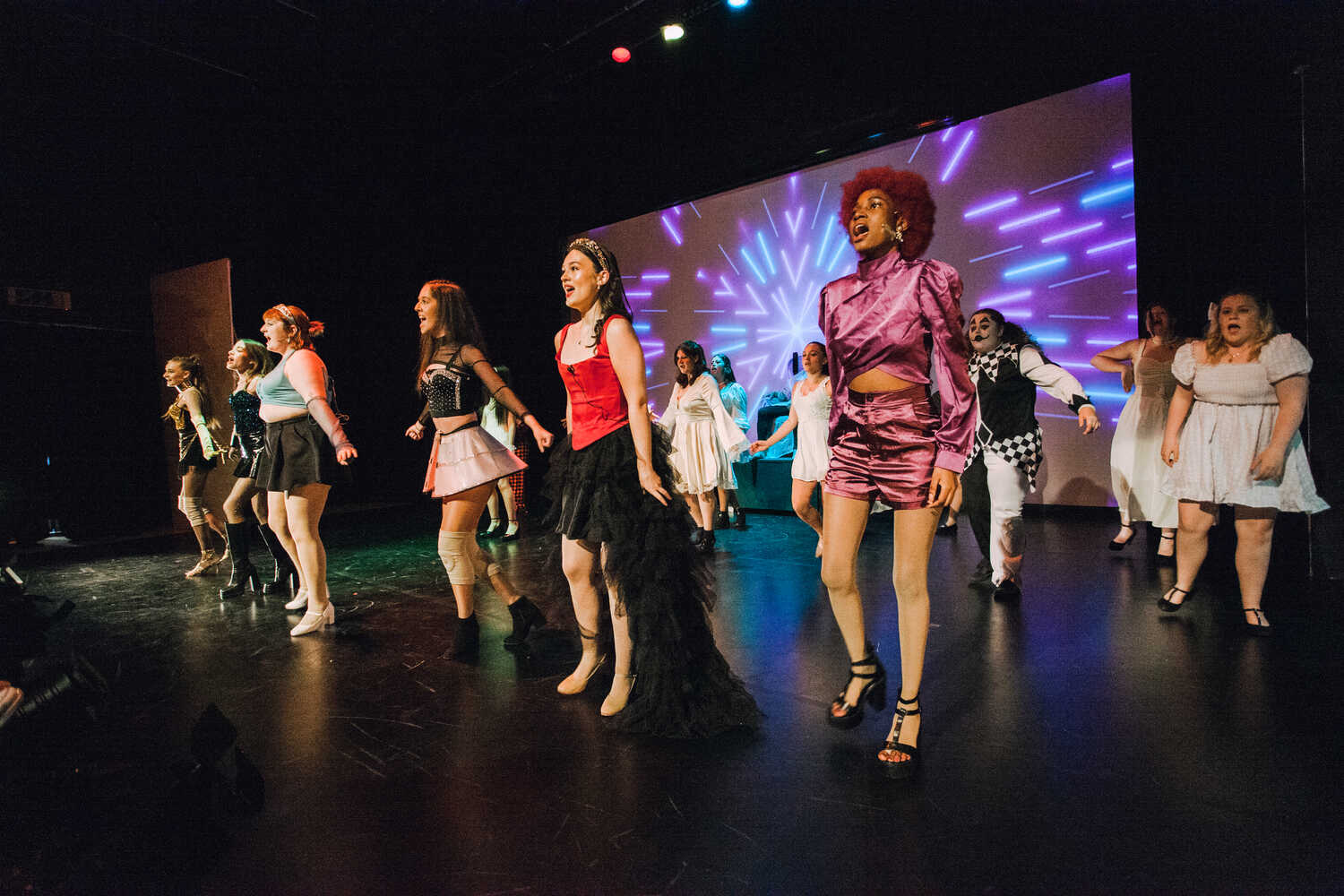 performing arts students performing in a show on stage