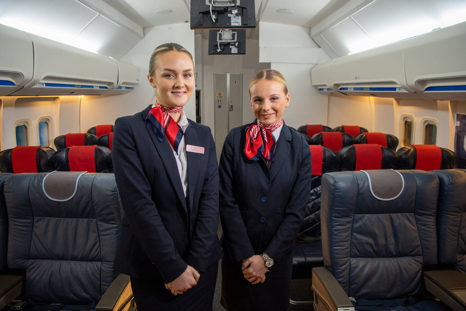 Travel and tourism students training on a plane