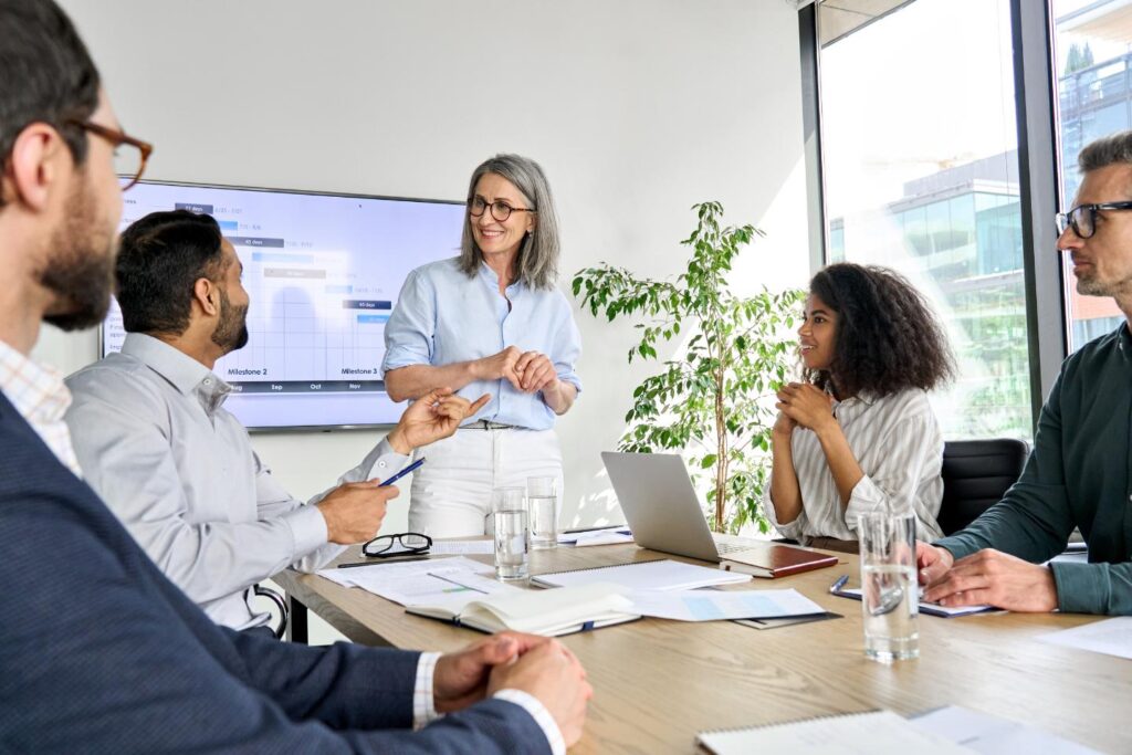 Image of people in a boardroom envrionment