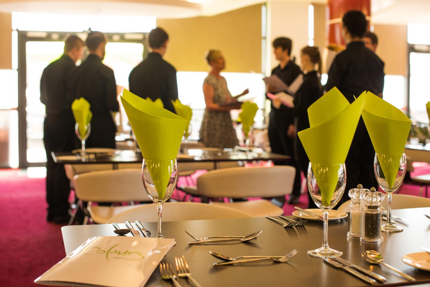 Students in colours restaurant preparing to open