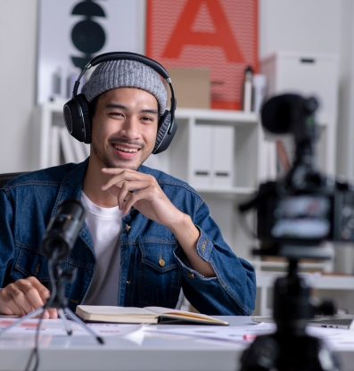 Person talking to camera with headphones on