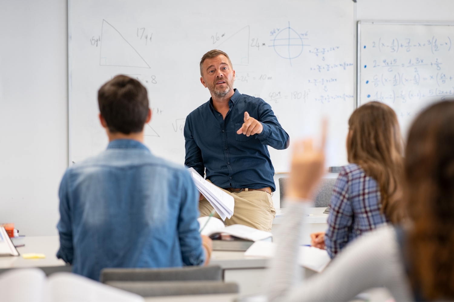 Tutor stood at the front of the class