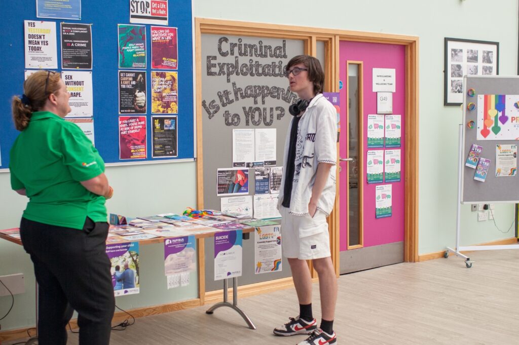 Safeguarding staff member talking to a student