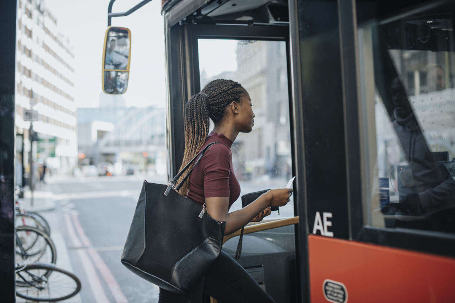 student getting on the bus