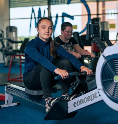 Picture of our student on a rowing machine