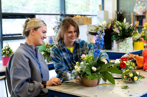 Students making flower arrangements in the flower studio