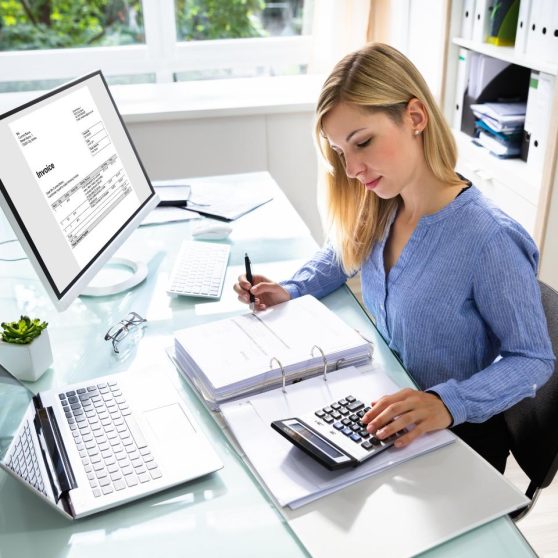 Female sat in an office with her laptop open, conducting work