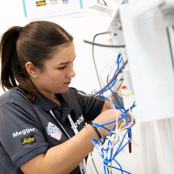 Female student in plumbing competition