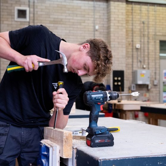 Picture of one of our students in our joinery workshop