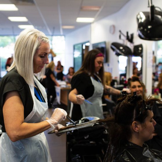 hairdressing students with clients